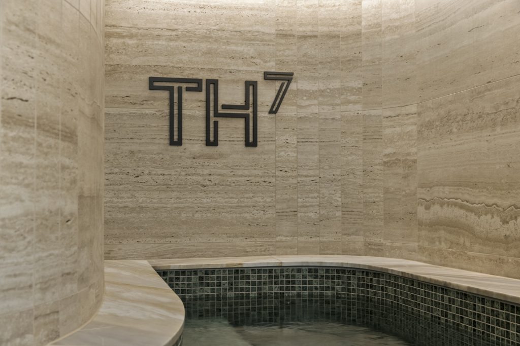 Cool baths at TH7 with stone tiling and green pool